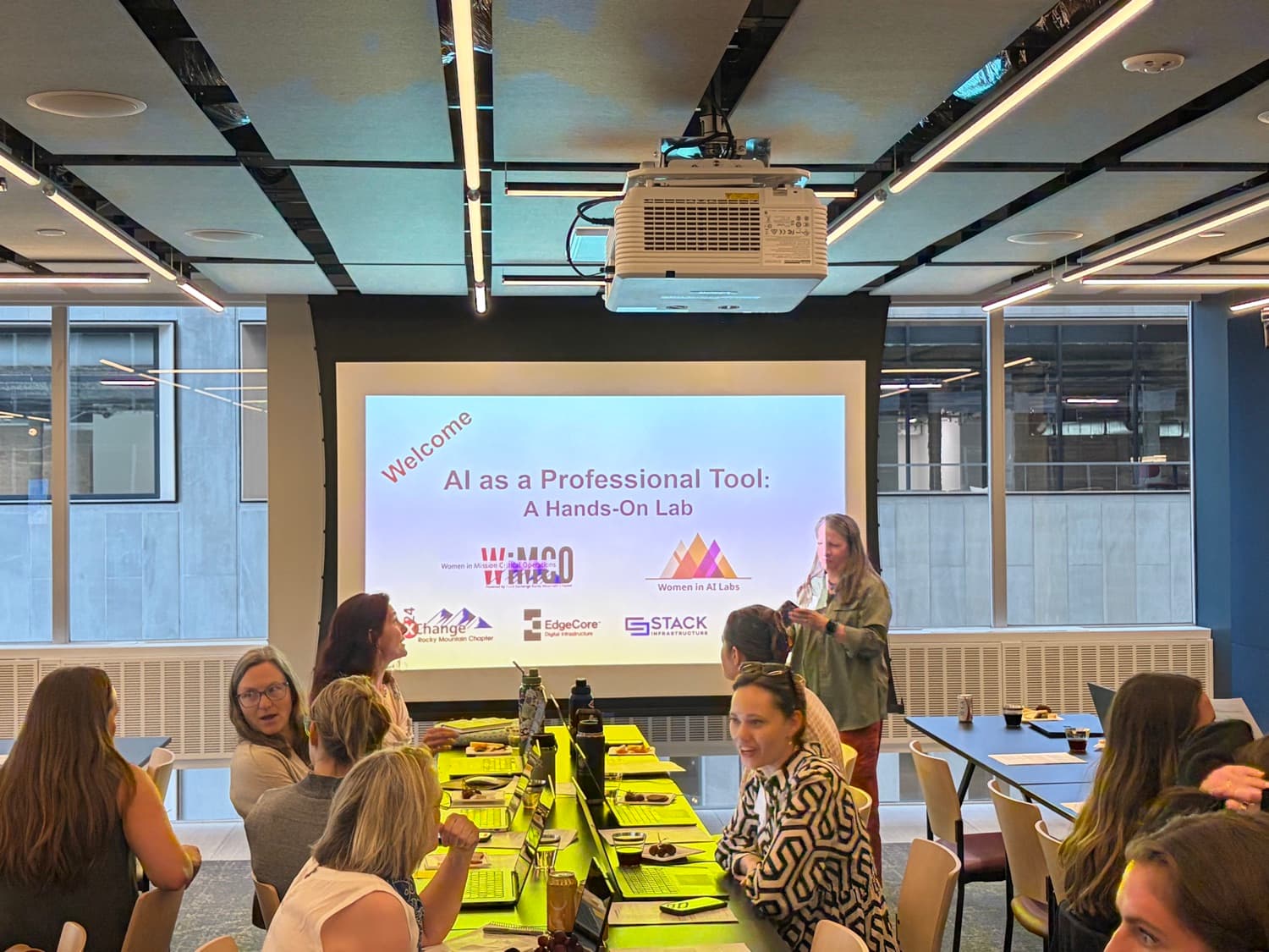 Susan Adams leading the Build Your AI Assistant lab for women in mission critical positions.